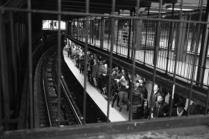 Commuters wait for the express train on the green line at the Union Sq. station.